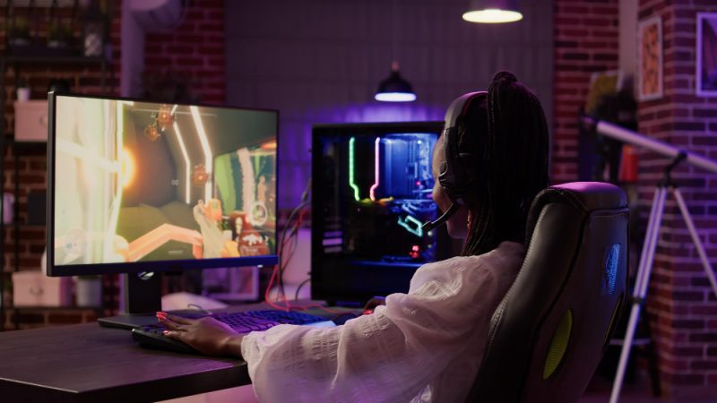 What Is Double NAT And How To Fix It 2024 SpeedTestGO African American Gamer Girl Using Pc Gaming Setup Having Good Time Playing Multiplayer Online Action Game Home Living Room Woman Streaming First Person Shooter While Talking Headset 800x450 